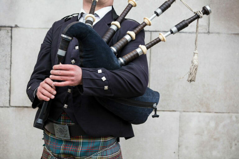 Bagpiper performing at funeral memorial service